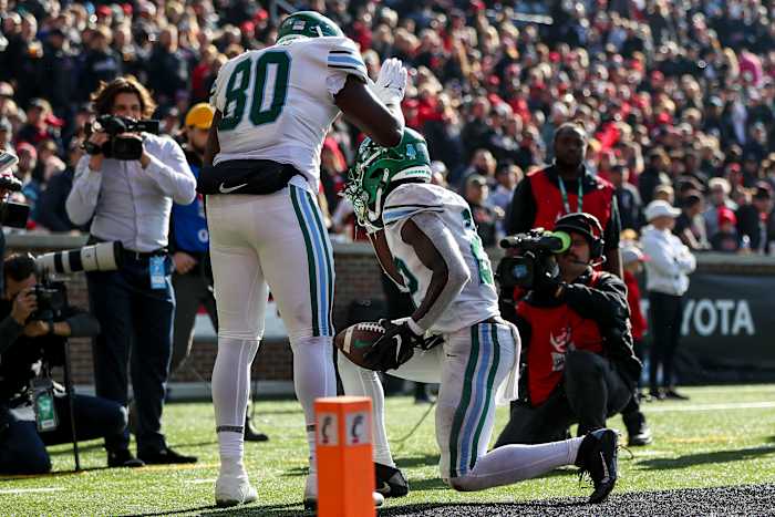 Nov 25, 2022; Cincinnati, Ohio, USA; Tulane Green Wave running back Tyjae Spears (22) reacts after scoring a touchdown with tight end Tyrick James (80) in the first half against the Cincinnati Bearcats at Nippert Stadium. Mandatory Credit: Katie Stratman-USA TODAY Sports